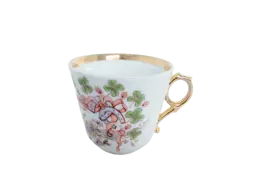 Teetasse mit Kleeblattdekor Weiße Teetasse mit Goldrand und Kleeblatt-Motiv