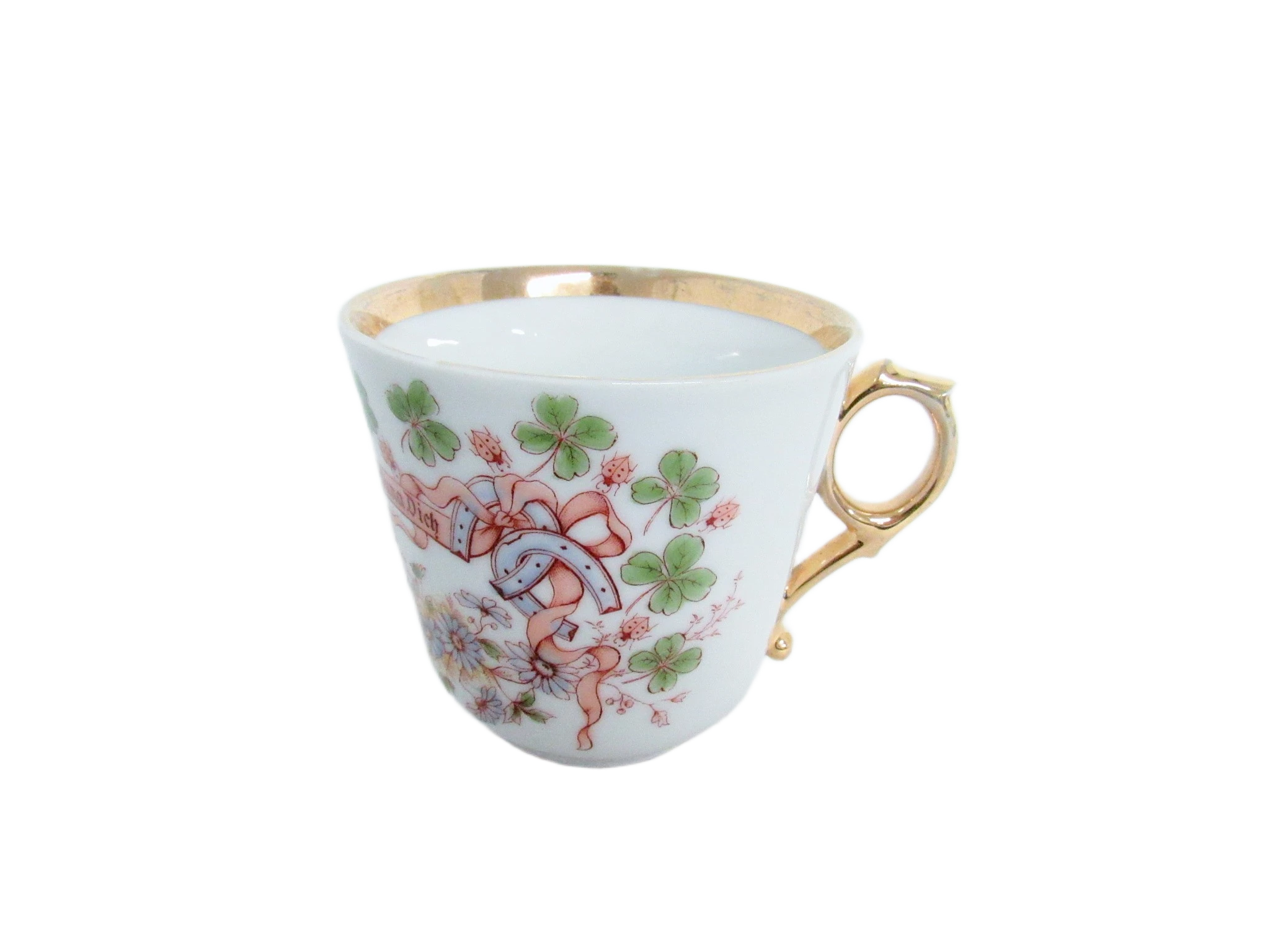Weiße Teetasse mit Goldrand und Kleeblatt-Motiv